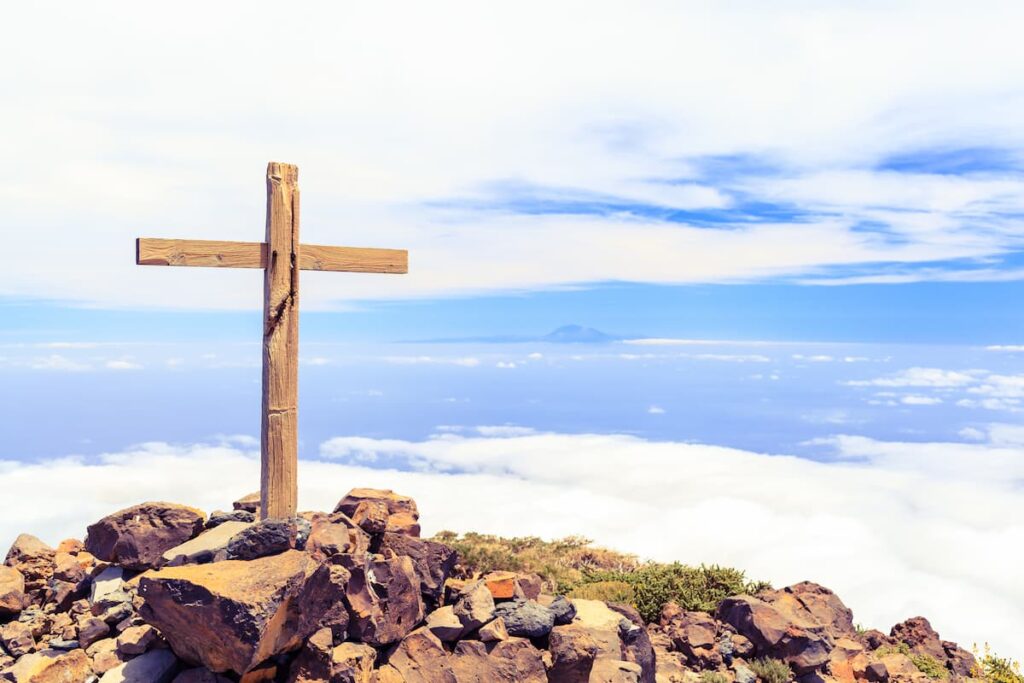 A Christian cross on a mountain.